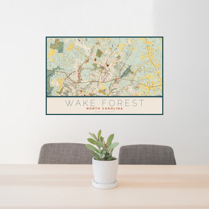 24x36 Wake Forest North Carolina Map Print Landscape Orientation in Woodblock Style Behind 2 Chairs Table and Potted Plant