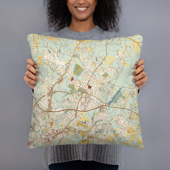 Person holding 18x18 Custom Wake Forest North Carolina Map Throw Pillow in Woodblock