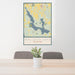 24x36 Walloon Lake Michigan Map Print Portrait Orientation in Woodblock Style Behind 2 Chairs Table and Potted Plant
