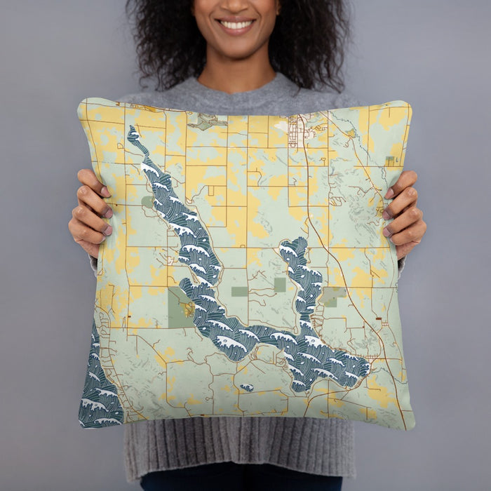 Person holding 18x18 Custom Walloon Lake Michigan Map Throw Pillow in Woodblock