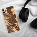 Custom Walnut Creek California Map Phone Case in Ember on Table with Black Headphones