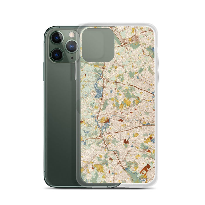 Custom Waltham Massachusetts Map Phone Case in Woodblock on Table with Laptop and Plant
