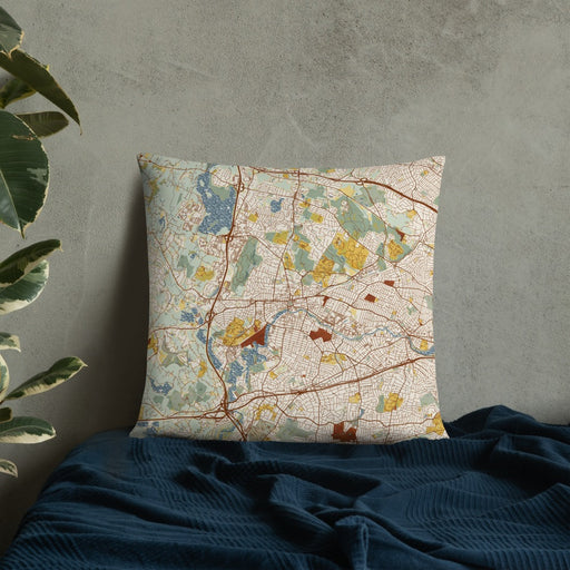 Custom Waltham Massachusetts Map Throw Pillow in Woodblock on Bedding Against Wall