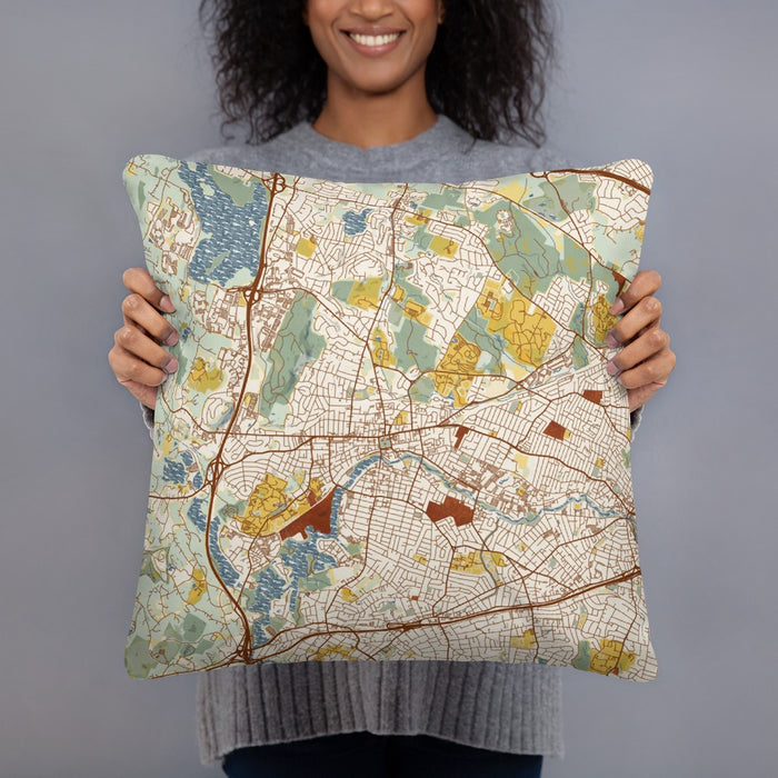 Person holding 18x18 Custom Waltham Massachusetts Map Throw Pillow in Woodblock