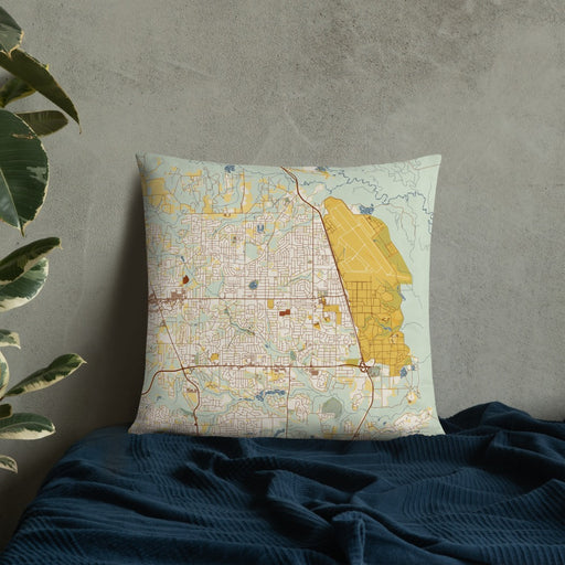 Custom Warner Robins Georgia Map Throw Pillow in Woodblock on Bedding Against Wall