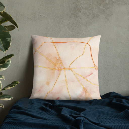 Custom Warren Ohio Map Throw Pillow in Watercolor on Bedding Against Wall