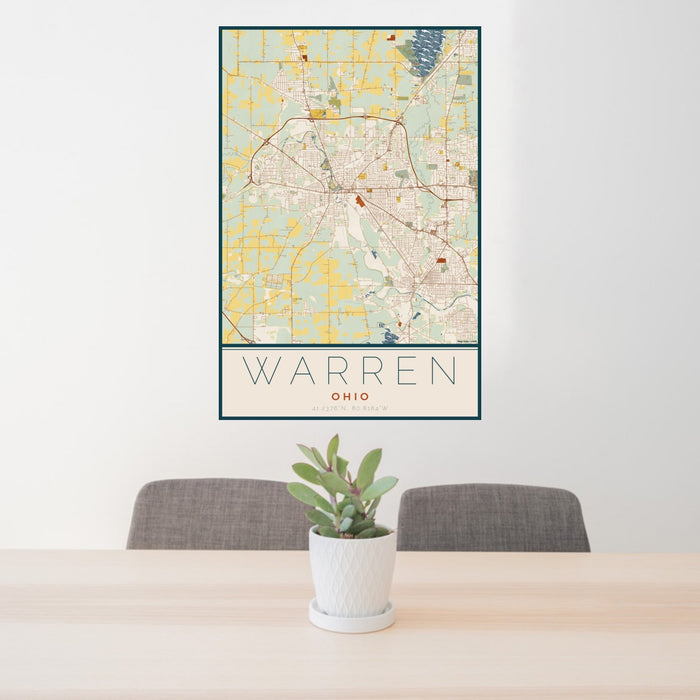 24x36 Warren Ohio Map Print Portrait Orientation in Woodblock Style Behind 2 Chairs Table and Potted Plant