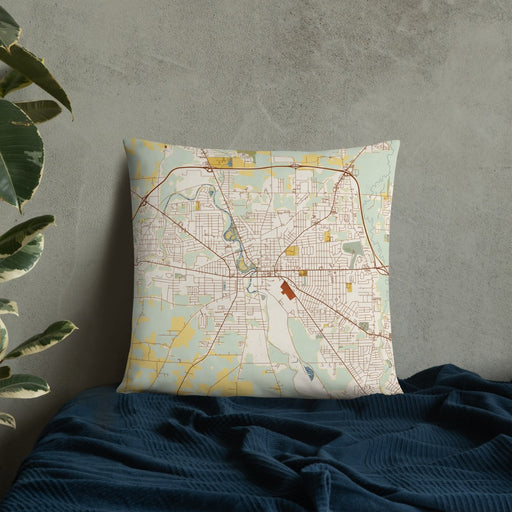 Custom Warren Ohio Map Throw Pillow in Woodblock on Bedding Against Wall