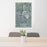 24x36 Warsaw Indiana Map Print Portrait Orientation in Afternoon Style Behind 2 Chairs Table and Potted Plant