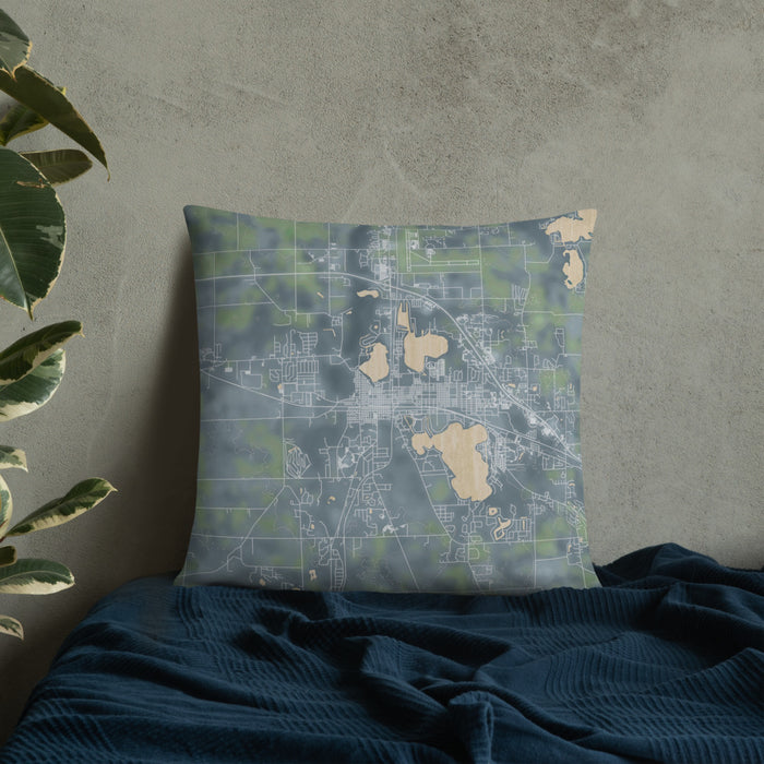 Custom Warsaw Indiana Map Throw Pillow in Afternoon on Bedding Against Wall
