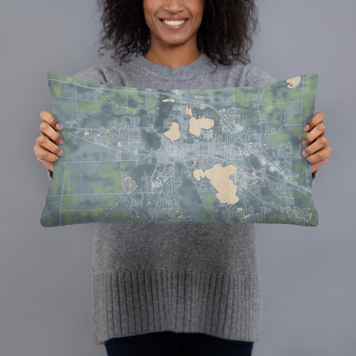 Person holding 20x12 Custom Warsaw Indiana Map Throw Pillow in Afternoon