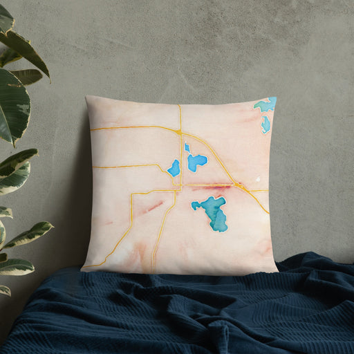 Custom Warsaw Indiana Map Throw Pillow in Watercolor on Bedding Against Wall