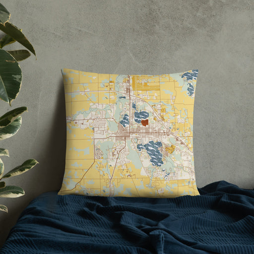 Custom Warsaw Indiana Map Throw Pillow in Woodblock on Bedding Against Wall