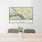 24x36 Washougal Washington Map Print Lanscape Orientation in Woodblock Style Behind 2 Chairs Table and Potted Plant