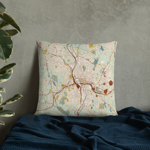 Custom Waterbury Connecticut Map Throw Pillow in Woodblock on Bedding Against Wall