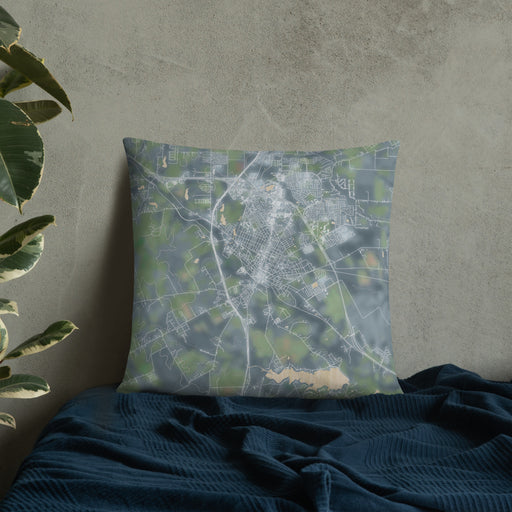 Custom Waxahachie Texas Map Throw Pillow in Afternoon on Bedding Against Wall
