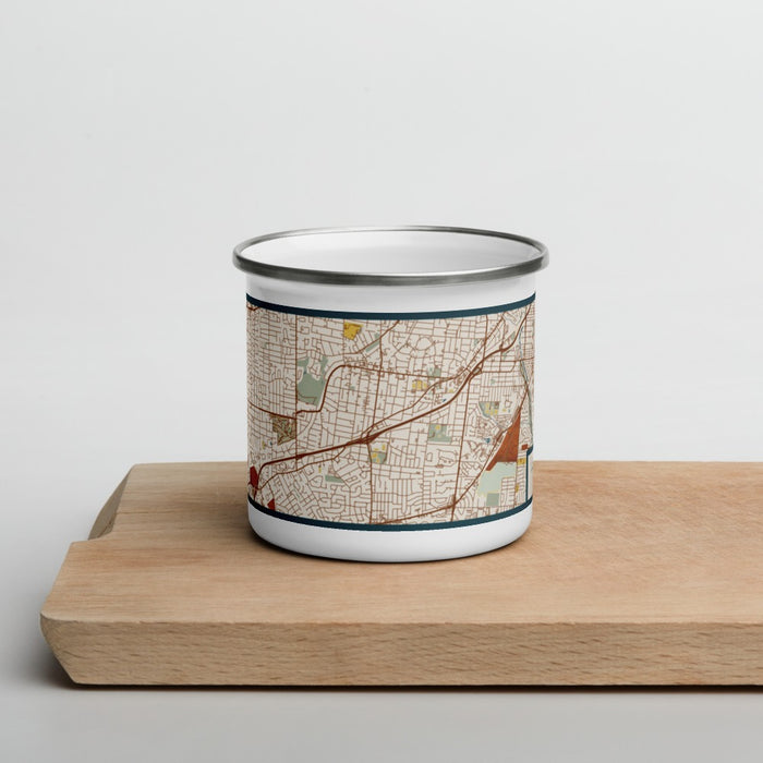 Front View Custom Webster Groves St. Louis Map Enamel Mug in Woodblock on Cutting Board