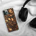 Custom West Newbury Massachusetts Map Phone Case in Ember on Table with Black Headphones