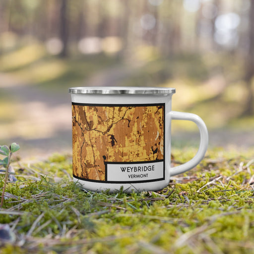 Right View Custom Weybridge Vermont Map Enamel Mug in Ember on Grass With Trees in Background