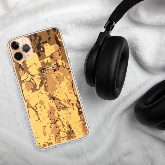 Custom Weybridge Vermont Map Phone Case in Ember on Table with Black Headphones