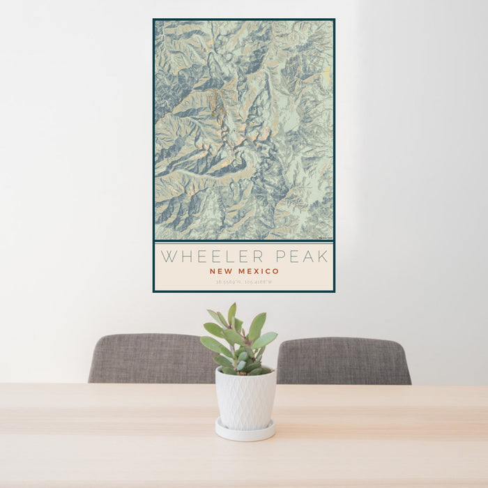 24x36 Wheeler Peak New Mexico Map Print Portrait Orientation in Woodblock Style Behind 2 Chairs Table and Potted Plant