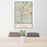 24x36 Wheeling West Virginia Map Print Portrait Orientation in Woodblock Style Behind 2 Chairs Table and Potted Plant