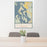24x36 Whidbey Island Washington Map Print Portrait Orientation in Woodblock Style Behind 2 Chairs Table and Potted Plant