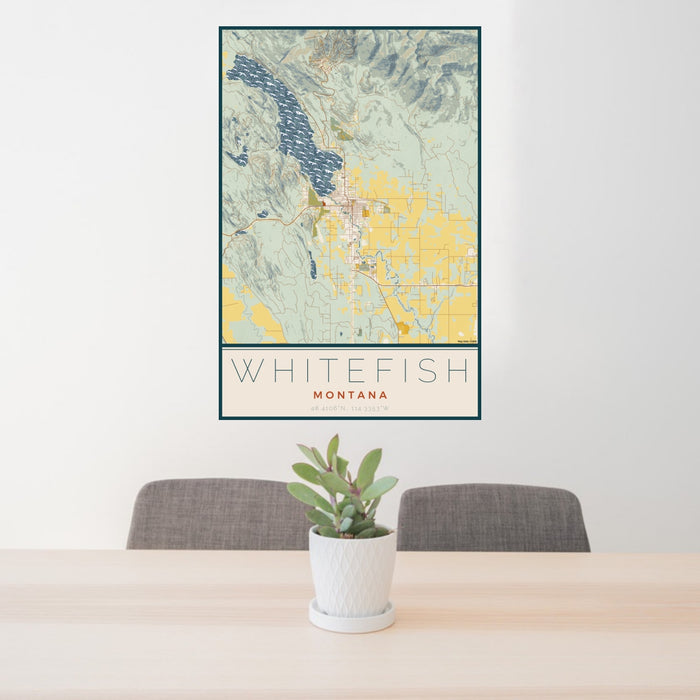 24x36 Whitefish Montana Map Print Portrait Orientation in Woodblock Style Behind 2 Chairs Table and Potted Plant