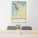 24x36 Whitefish Montana Map Print Portrait Orientation in Woodblock Style Behind 2 Chairs Table and Potted Plant