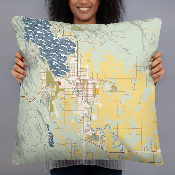 Person holding 22x22 Custom Whitefish Montana Map Throw Pillow in Woodblock