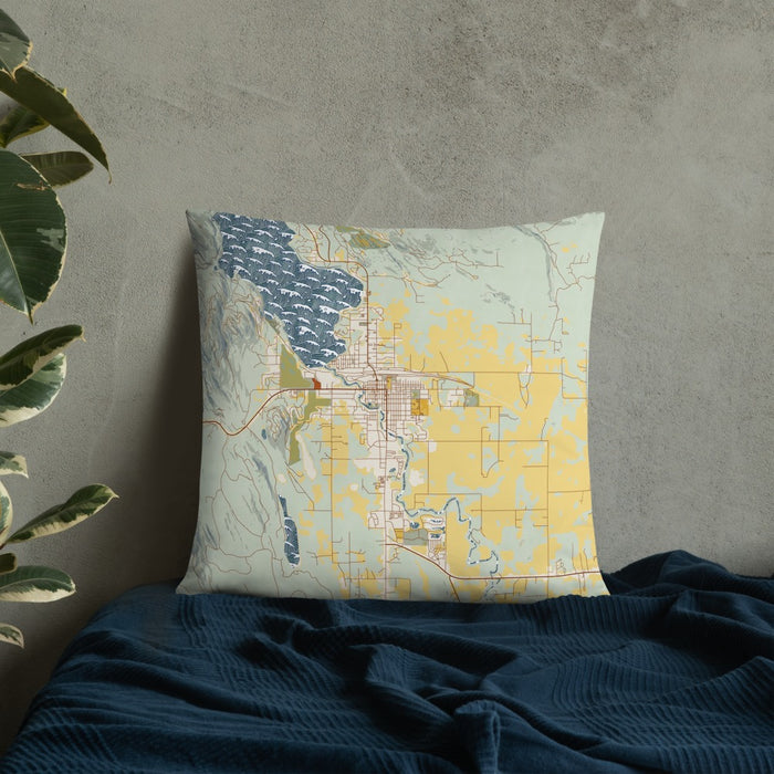 Custom Whitefish Montana Map Throw Pillow in Woodblock on Bedding Against Wall