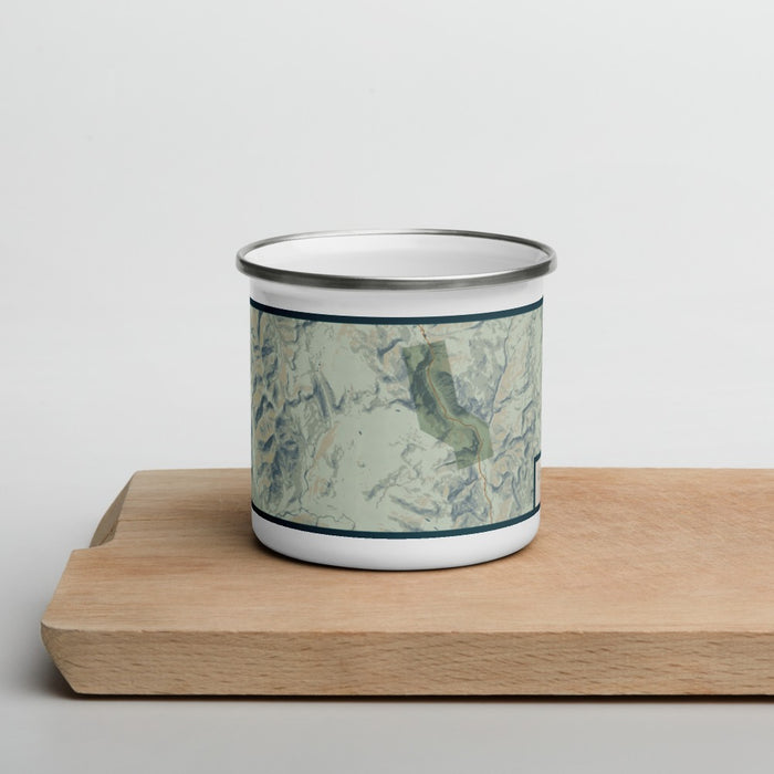 Front View Custom White Mountains New Hampshire Map Enamel Mug in Woodblock on Cutting Board