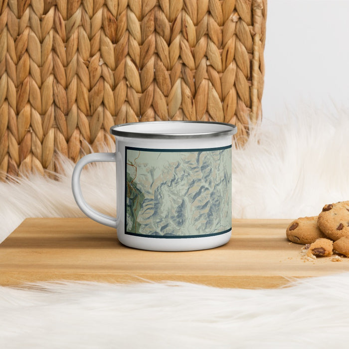 Left View Custom White Mountains New Hampshire Map Enamel Mug in Woodblock on Table Top