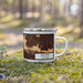 Right View Custom Whittier California Map Enamel Mug in Ember on Grass With Trees in Background