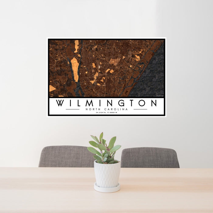 24x36 Wilmington North Carolina Map Print Landscape Orientation in Ember Style Behind 2 Chairs Table and Potted Plant