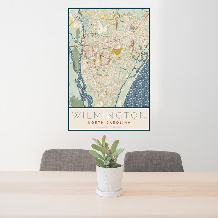 24x36 Wilmington North Carolina Map Print Portrait Orientation in Woodblock Style Behind 2 Chairs Table and Potted Plant