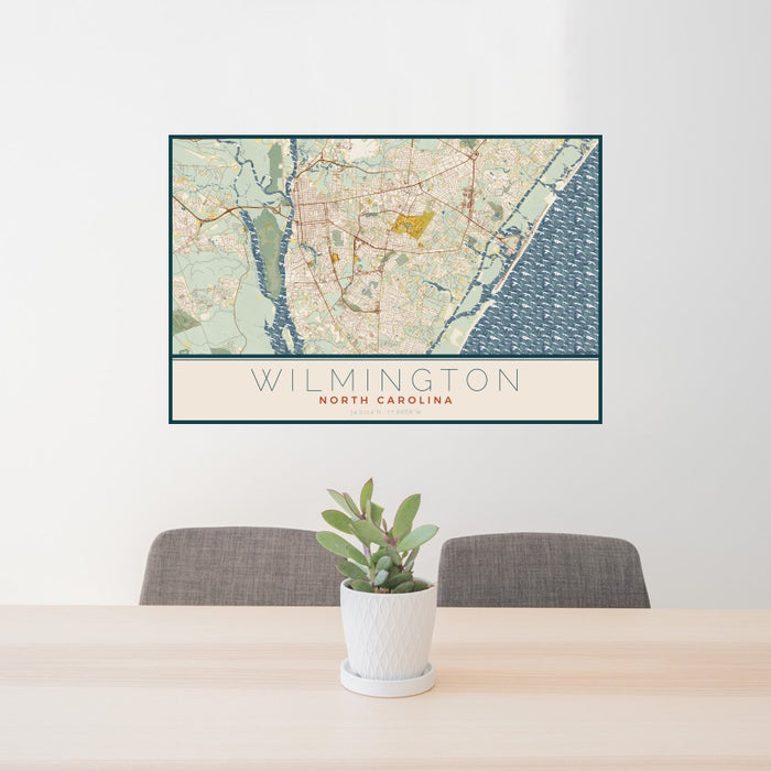 24x36 Wilmington North Carolina Map Print Landscape Orientation in Woodblock Style Behind 2 Chairs Table and Potted Plant