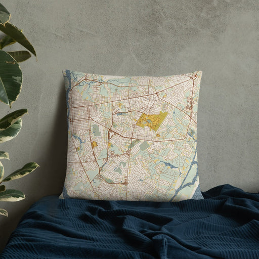 Custom Wilmington North Carolina Map Throw Pillow in Woodblock on Bedding Against Wall