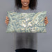 Person holding 20x12 Custom Wind River Range Wyoming Map Throw Pillow in Woodblock
