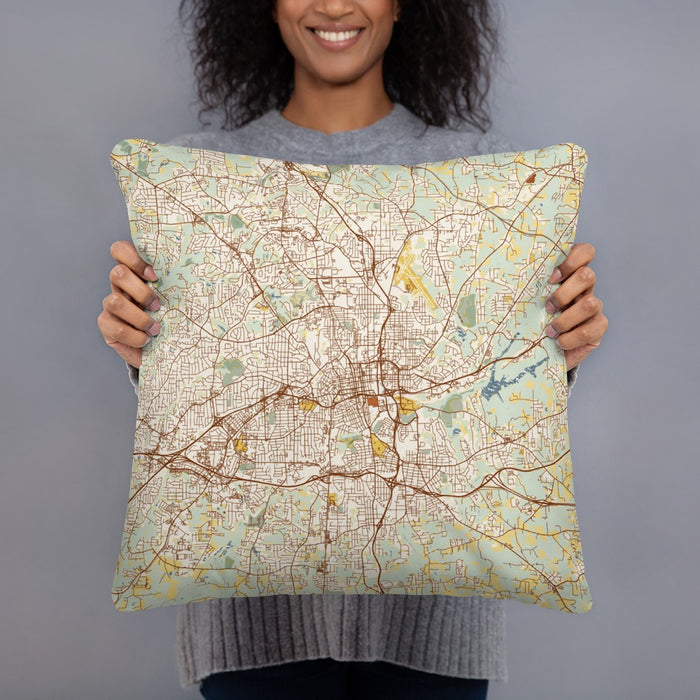 Person holding 18x18 Custom Winston-Salem North Carolina Map Throw Pillow in Woodblock