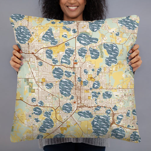 Person holding 22x22 Custom Winter Haven Florida Map Throw Pillow in Woodblock
