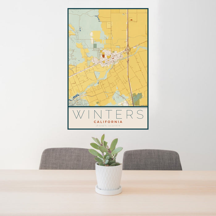 24x36 Winters California Map Print Portrait Orientation in Woodblock Style Behind 2 Chairs Table and Potted Plant