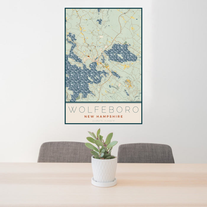 24x36 Wolfeboro New Hampshire Map Print Portrait Orientation in Woodblock Style Behind 2 Chairs Table and Potted Plant