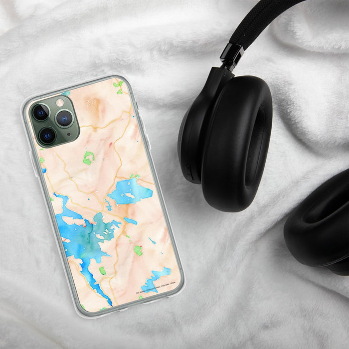 Custom Wolfeboro New Hampshire Map Phone Case in Watercolor on Table with Black Headphones