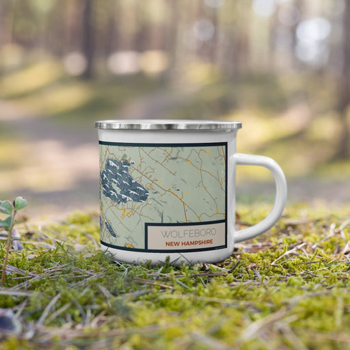 Right View Custom Wolfeboro New Hampshire Map Enamel Mug in Woodblock on Grass With Trees in Background