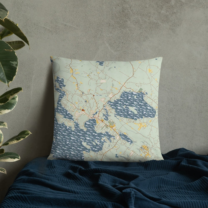 Custom Wolfeboro New Hampshire Map Throw Pillow in Woodblock on Bedding Against Wall