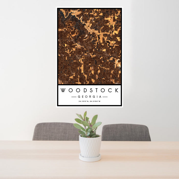24x36 Woodstock Georgia Map Print Portrait Orientation in Ember Style Behind 2 Chairs Table and Potted Plant