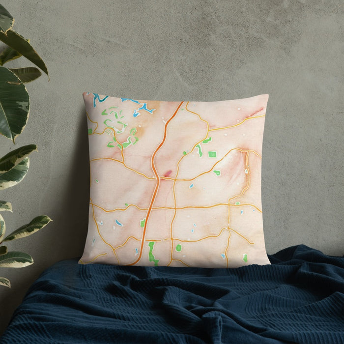 Custom Woodstock Georgia Map Throw Pillow in Watercolor on Bedding Against Wall