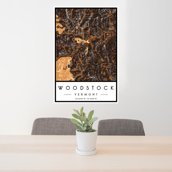 24x36 Woodstock Vermont Map Print Portrait Orientation in Ember Style Behind 2 Chairs Table and Potted Plant