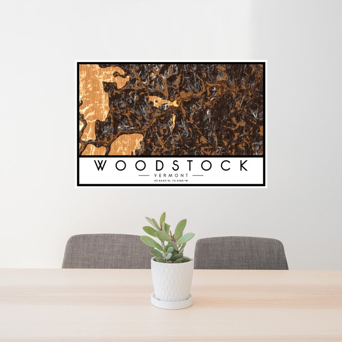 24x36 Woodstock Vermont Map Print Landscape Orientation in Ember Style Behind 2 Chairs Table and Potted Plant